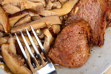 Image showing venison deer game filet and wild mushrooms