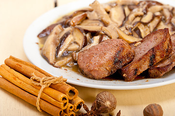 Image showing venison deer game filet and wild mushrooms