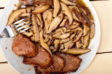 Image showing venison deer game filet and wild mushrooms