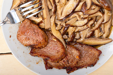 Image showing venison deer game filet and wild mushrooms