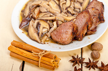 Image showing venison deer game filet and wild mushrooms