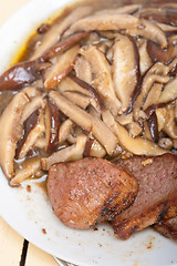 Image showing venison deer game filet and wild mushrooms