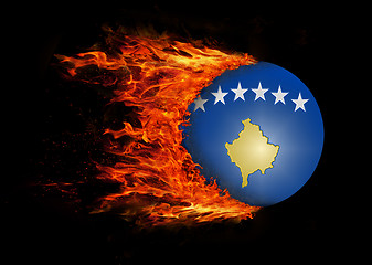 Image showing Flag with a trail of fire - Kosovo