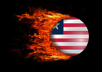 Image showing Flag with a trail of fire - Liberia