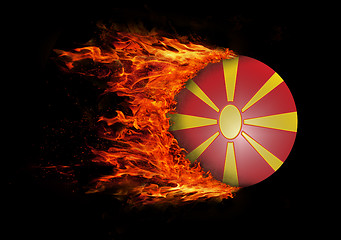 Image showing Flag with a trail of fire - Macedonia