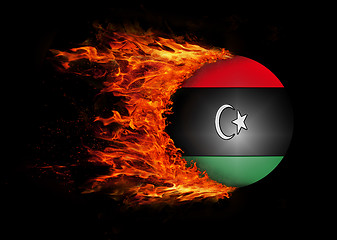 Image showing Flag with a trail of fire - Libya