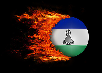 Image showing Flag with a trail of fire - Lesotho