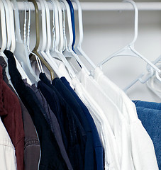 Image showing shirts hanging in closet