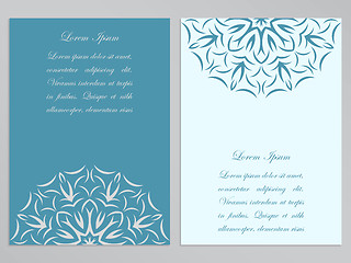 Image showing Blue and white flyers with ornate flower pattern