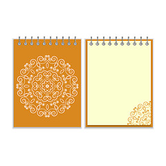 Image showing Orange cover notebook with round floral pattern