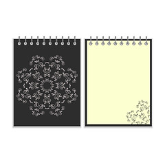 Image showing Black cover notebook with round ornate star pattern