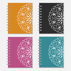 Image showing Set of colorful notebook covers with flower design