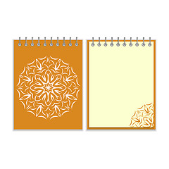 Image showing Orange cover notebook with round florwer pattern