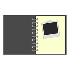 Image showing Open notebook with photo