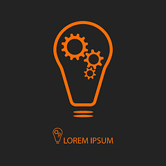 Image showing Orange bulb with gearwheels on black