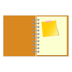 Image showing Open notebook with yellow sticker