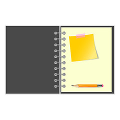 Image showing Open notebook with yellow sticker and pencil