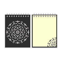 Image showing Spiral black cover notebook with round ornate pattern