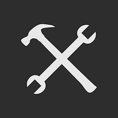 Image showing Crossed white tools on dark grey background