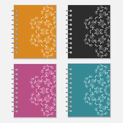 Image showing Set of colorful notebook covers with flower design