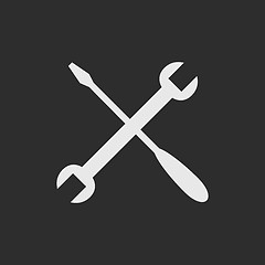 Image showing White crossed tools on dark grey background