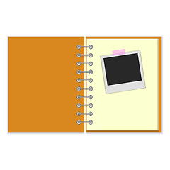 Image showing Open notebook with photo