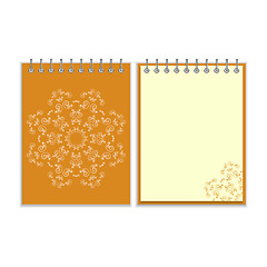 Image showing Orange cover notebook with round ornate star pattern