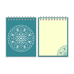 Image showing Blue cover notebook with round florwer pattern