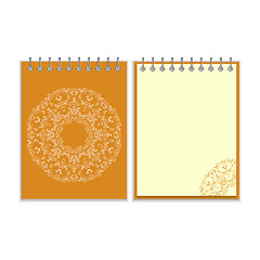 Image showing Orange cover notebook with round ornate pattern
