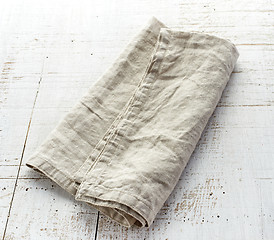 Image showing linen napkin on wooden table