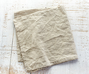 Image showing linen napkin on wooden table