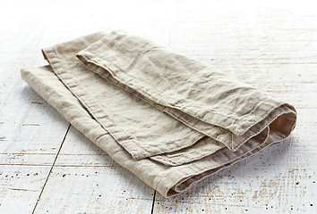 Image showing linen napkin on wooden table