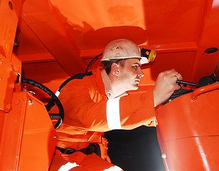 Image showing Miner operating heavy machinery