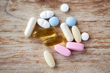 Image showing pills and omega 3 oil capsules on table