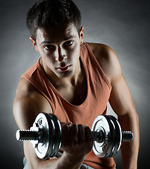 Image showing young man with dumbbell