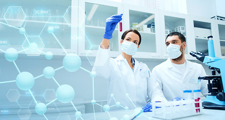 Image showing young scientists making test or research in lab