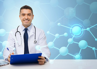 Image showing happy doctor with clipboard over blue background