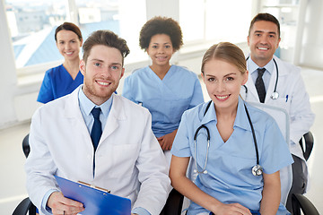 Image showing group of happy doctors on seminar at hospital