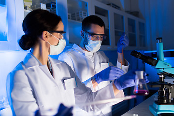 Image showing close up of scientists making test in lab