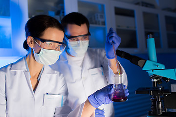 Image showing close up of scientists making test in lab