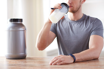 Image showing close up of man drinking protein shake