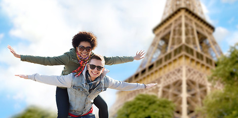 Image showing happy teenage couple over paris eiffel tower