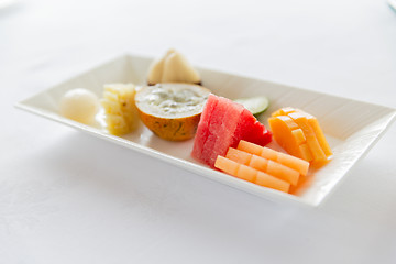 Image showing plate of fresh juicy fruit dessert at restaurant