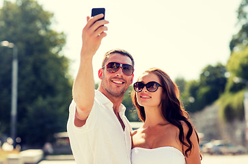 Image showing smiling couple in city