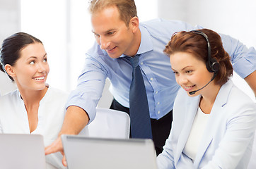 Image showing group of people working in call center