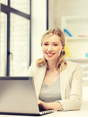 Image showing happy woman with laptop computer