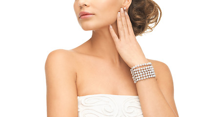 Image showing woman with pearl earrings and bracelet