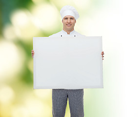 Image showing happy male chef cook holding white blank big board