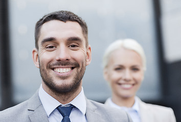 Image showing close up of smiling businessmen