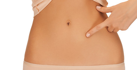 Image showing woman pointing finger to belly